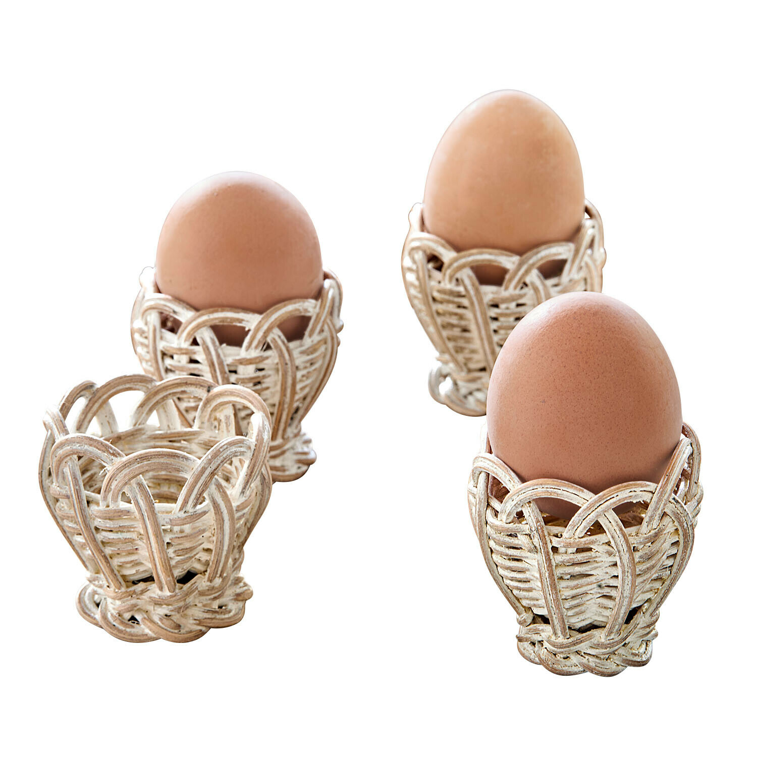 Set de 4 hueveras Minouvelle Conjunto de soportes para huevos de mimbre blanco con huevos marrones naturales para desayuno