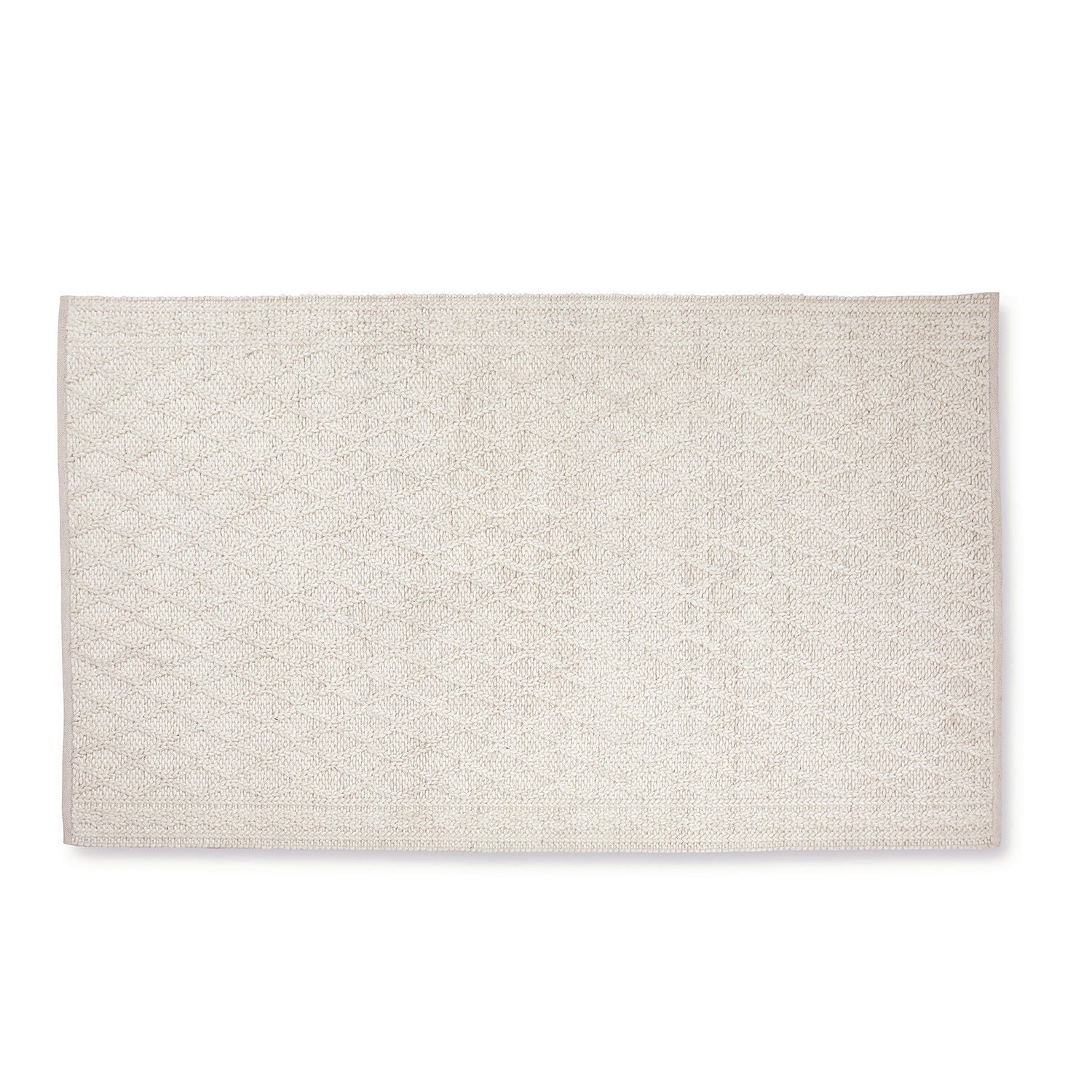 Alfombra crema Poloma de material suave con patrón geométrico sutil, ideal para salón