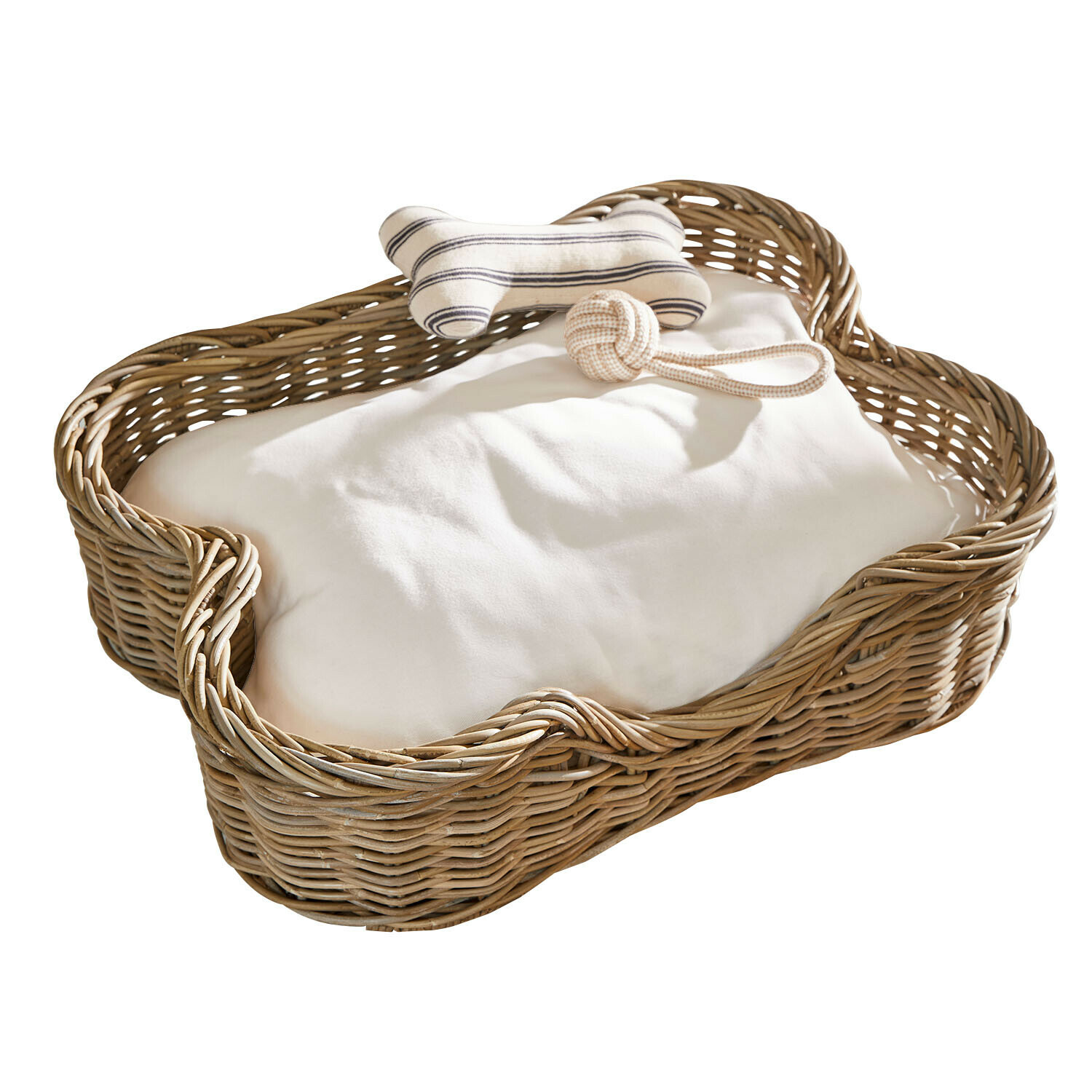Cama para mascotas Ninloo Cesta para perro de mimbre con cojín blanco y dos juguetes en forma de hueso y pelota