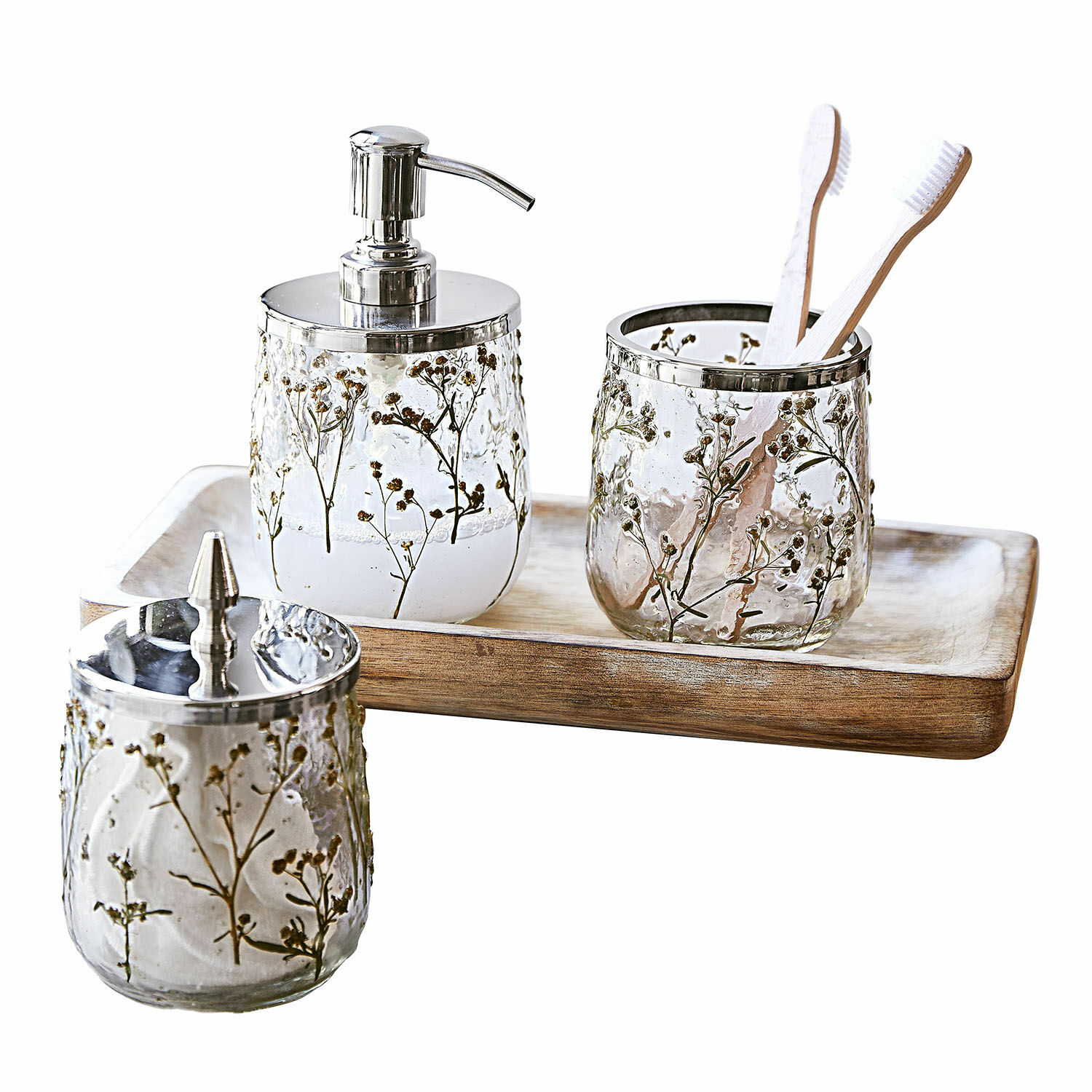 Set de baño Elorisse Set de baño de vidrio con diseño de flores secas y detalles metálicos sobre bandeja de madera