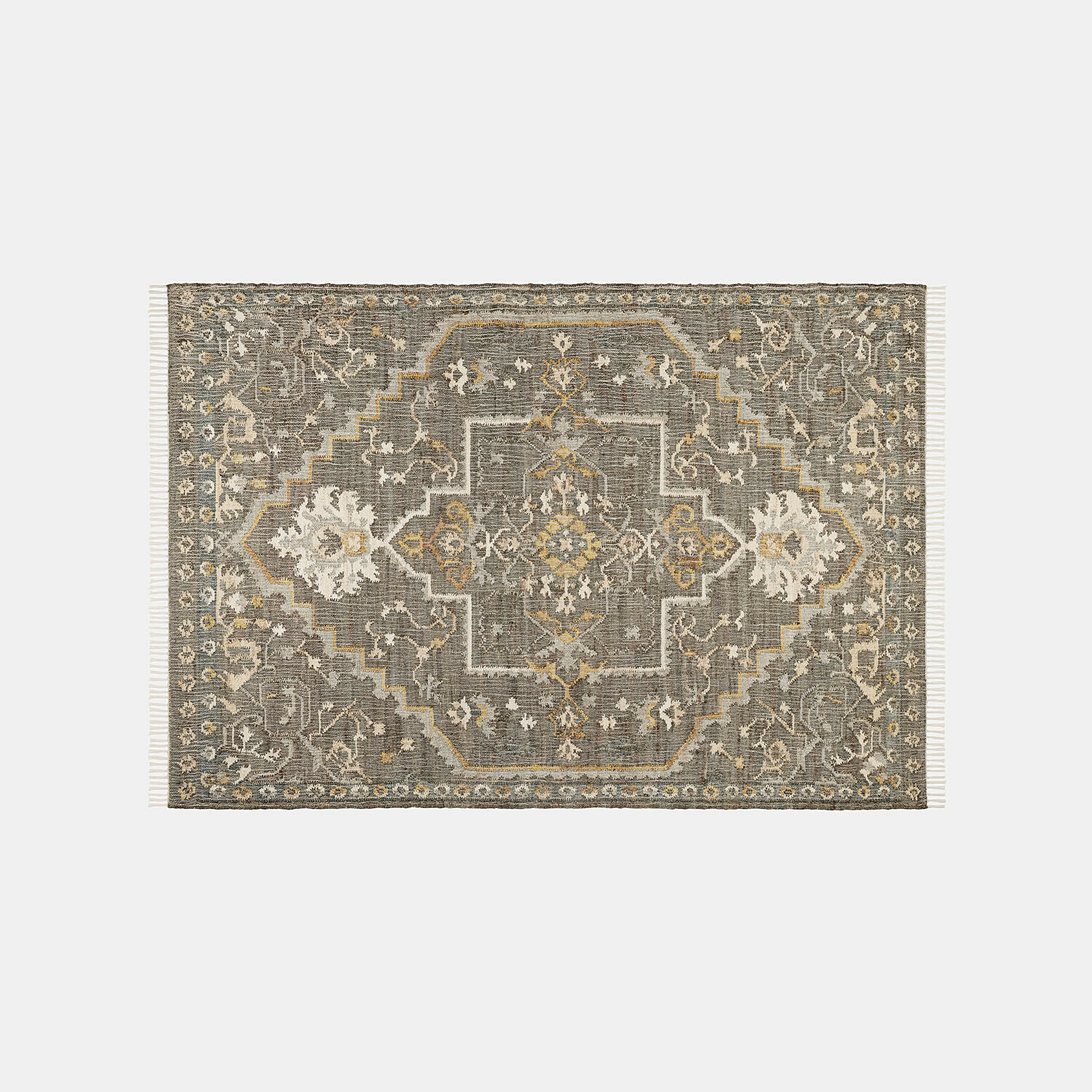 Alfombra con diseño oriental en tonos grises y beige con flecos a los lados