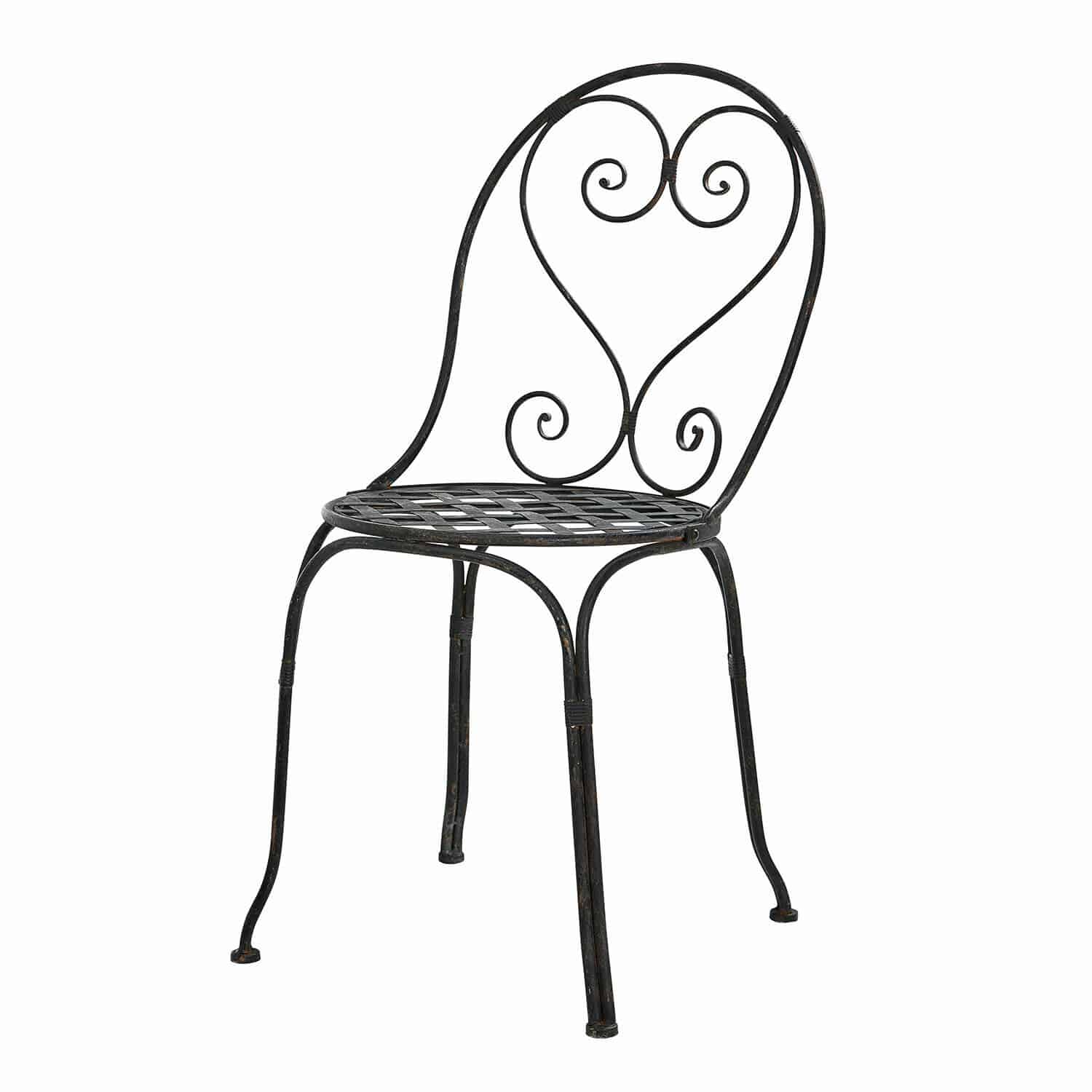 Silla de jardín de metal negro con respaldo decorativo y asiento de rejilla