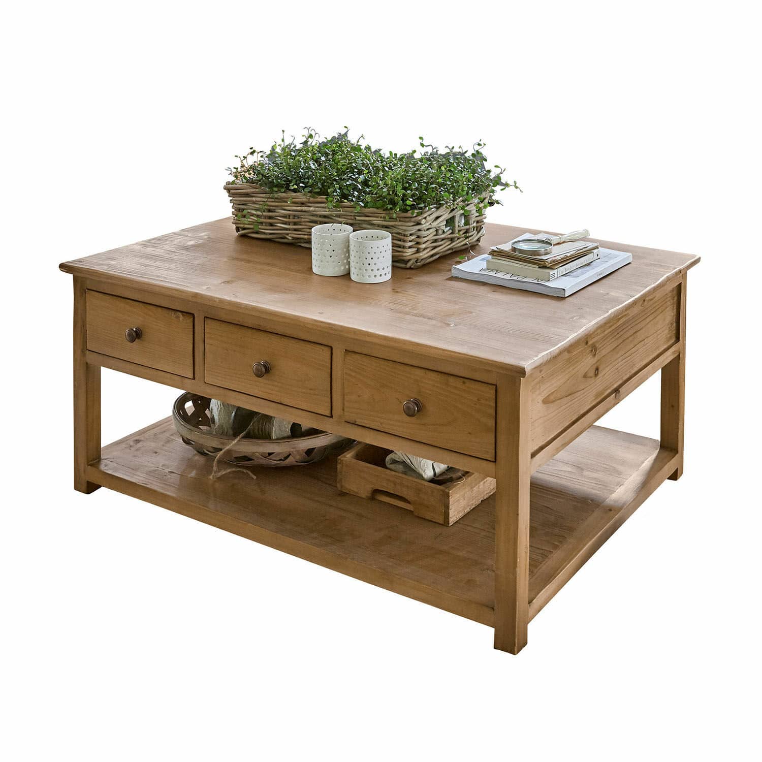 Mesa de centro Etienne Mesa de centro de madera natural con tres cajones y estante inferior, decorada con plantas y libros