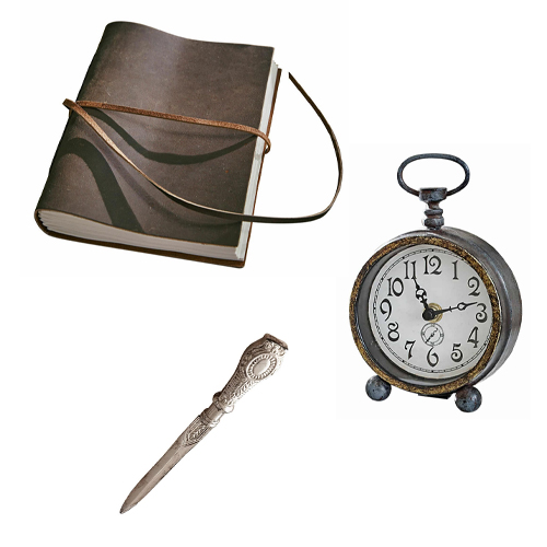 Conjunto vintage con cuaderno de cuero marrón, reloj de mesa de metal y cuchillo decorativo para cartas