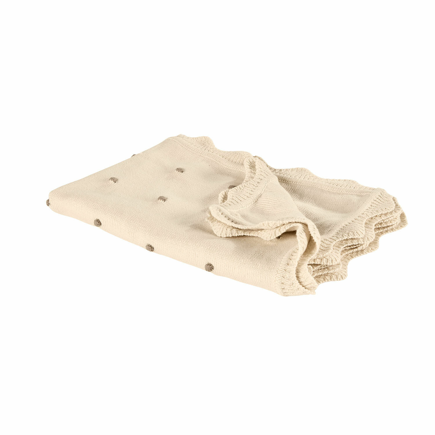 Plaid Saphie Manta beige de punto con pequeños lunares marrones y borde ondulado, tejido suave.