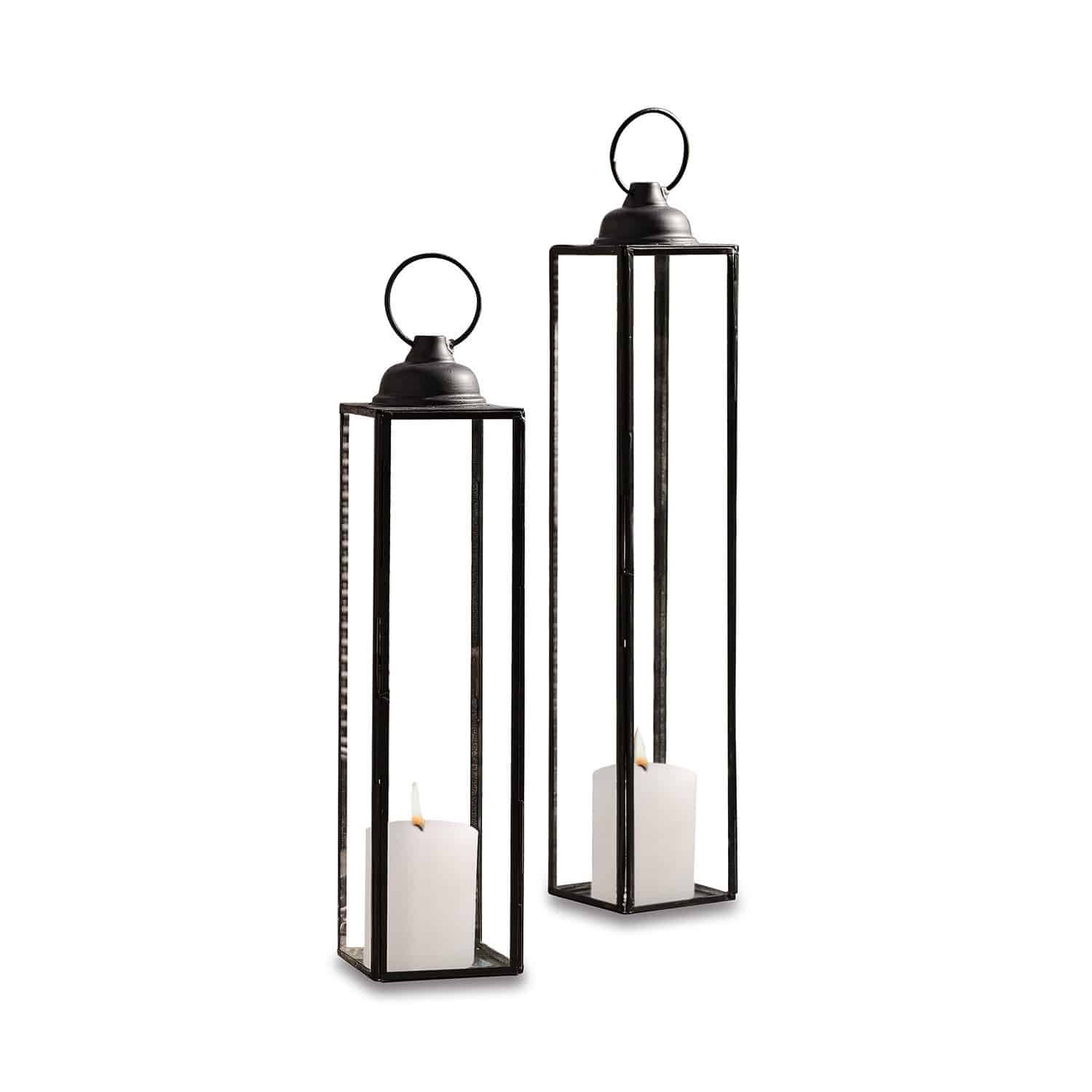 Set de 2 faroles Radu Conjunto de dos faroles de metal negro con velas blancas para decoración interior y exterior