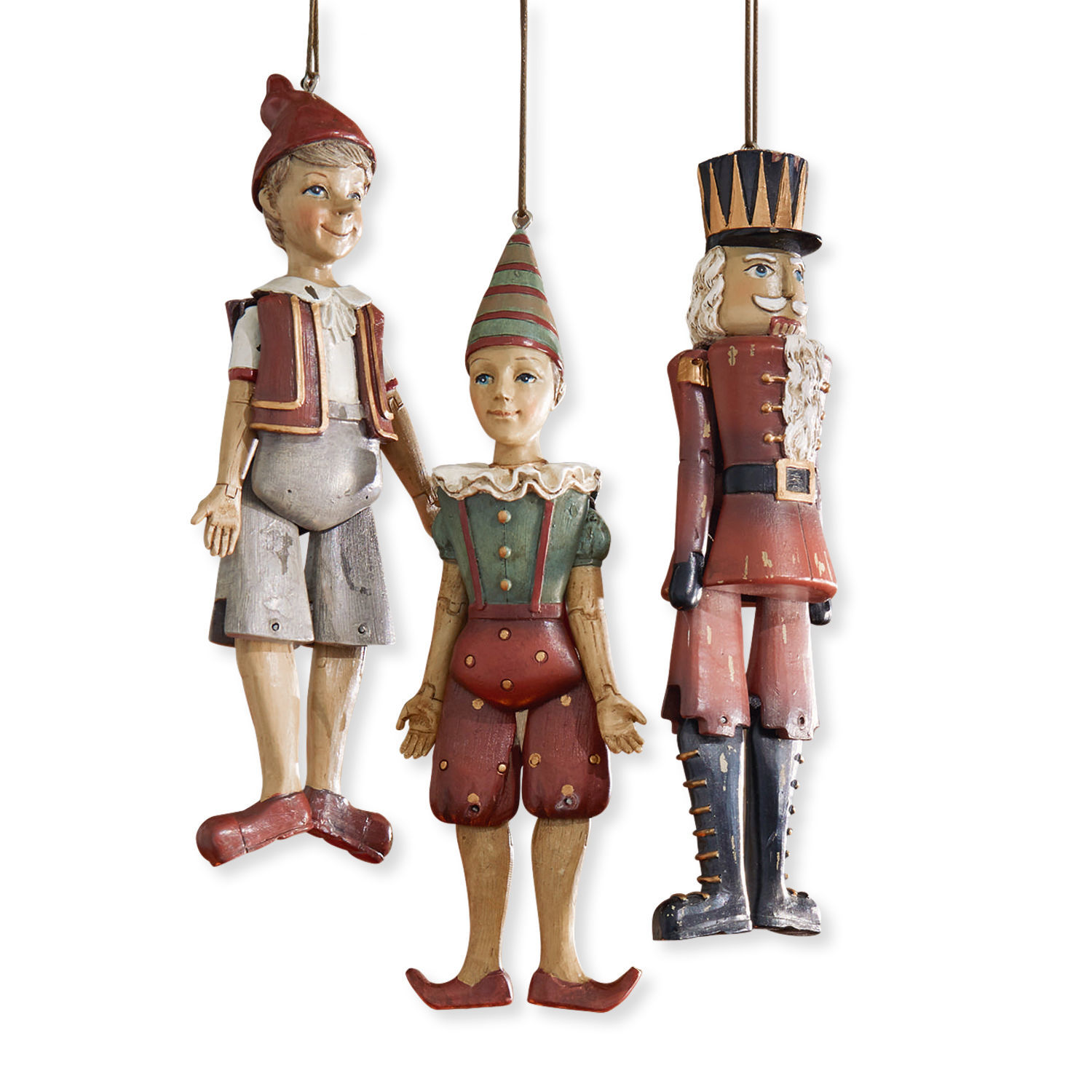 Set de 3 figuras Udine Conjunto de tres colgantes de madera vintage: Pinocho, payaso y soldado en colores rojo y verde