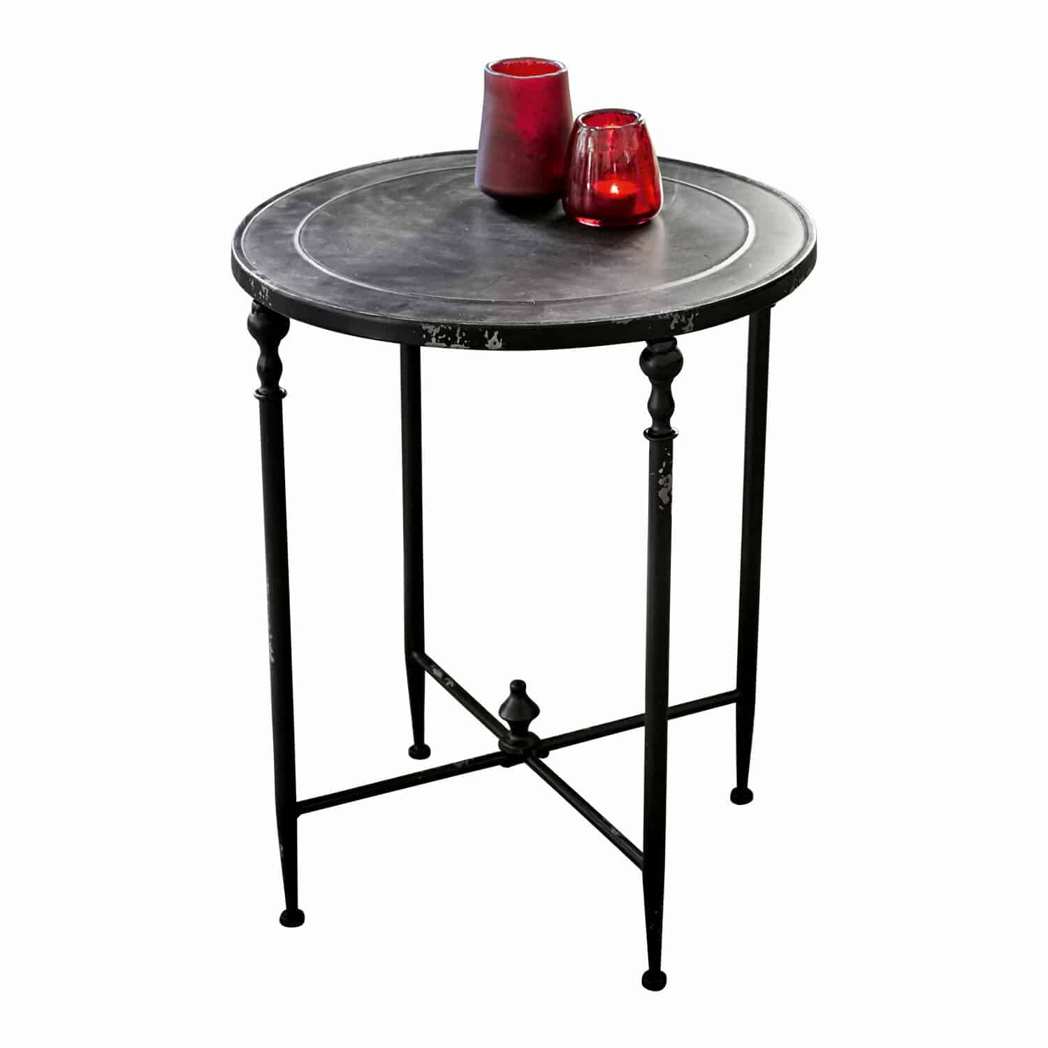 Mesa auxiliar Danbury Mesa auxiliar redonda negra de metal con patas decorativas y portavelas rojos encima