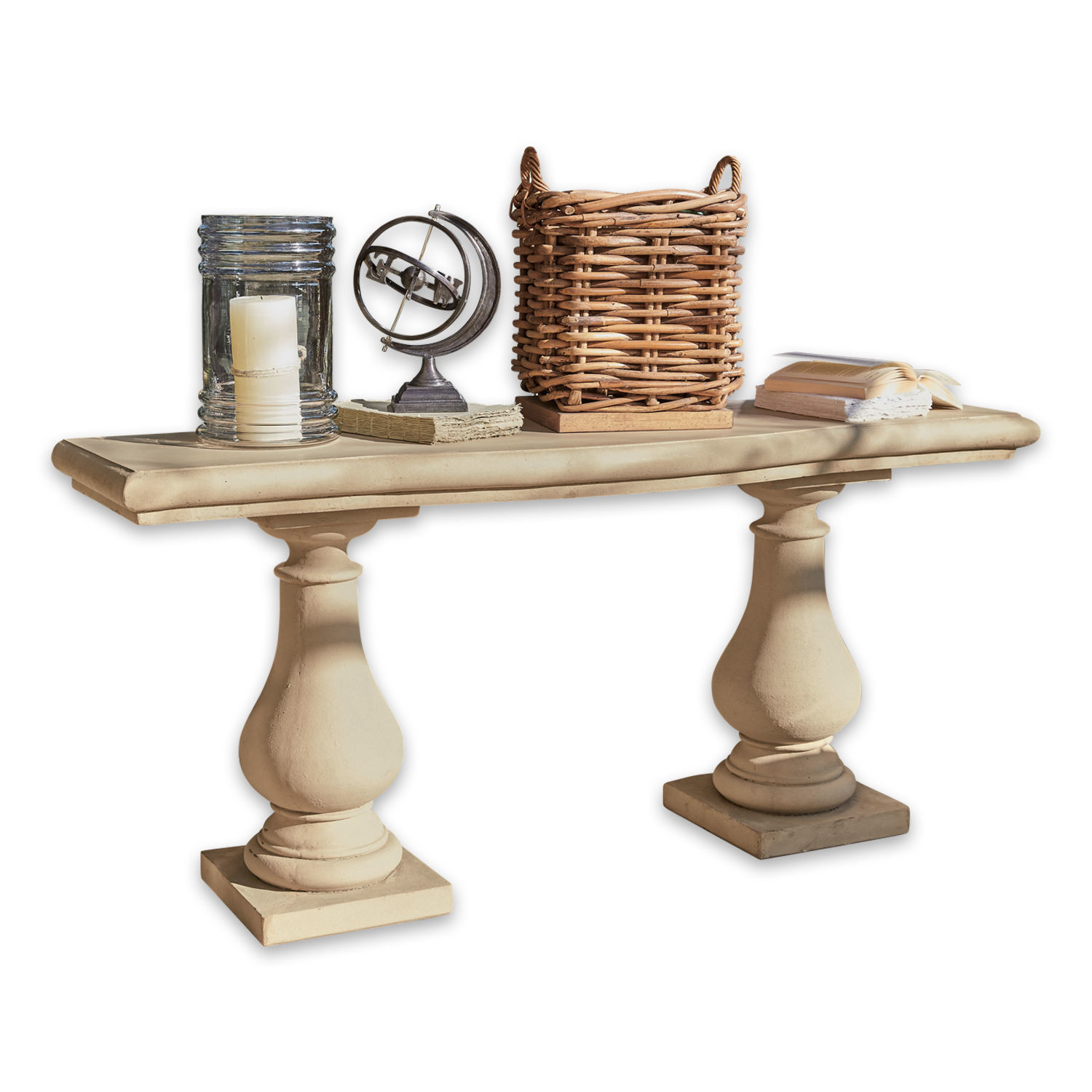 Consola Carrington Mesa de piedra beige con dos patas decorativas, adornada con vela, libros y cesta de mimbre